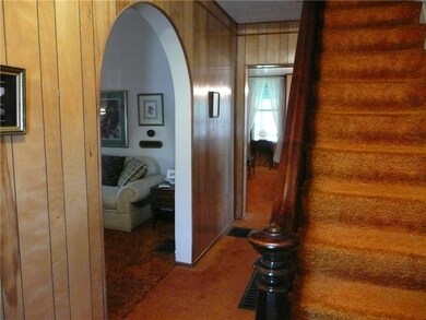 ENTRY FOYER WITH ARCHED DOORWAY TO LIVING ROOM