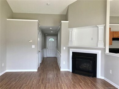 Family room with laminate wood flooring.