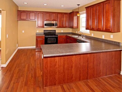 Kitchen. A kitchen you will love to spend time in!  Lots of cabinetry and counter space, tasteful finishes, and recessed lighting!  The pendant above the sink adds a nice touch...