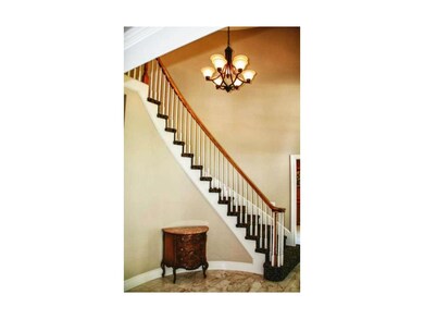 Stately grand entry with beautiful marble floor.
