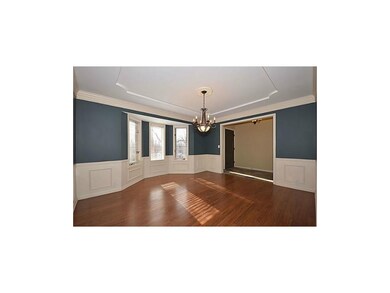 Elegant hardwoods and wainscoating in the formal d