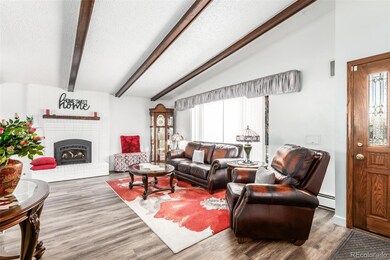 Large living room with gas fireplace, newer floori
