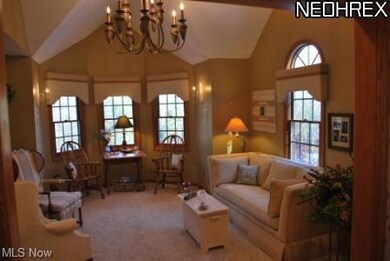 Formal living with custom vaulted ceilings and cha