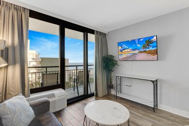 Living room with a wall of windows, baseboards, an