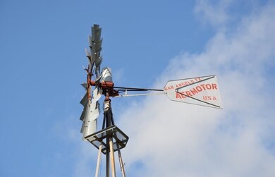 Vintage Aero Motor windmill to be installed at entrance.