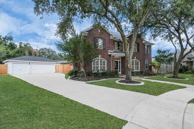 Long private driveway with a detached 3-car garage