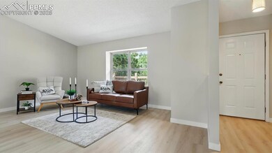 Front Entry into the Living room with view window to the front yard that brings in lots of natural light.