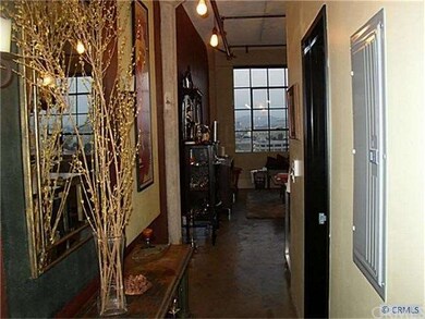Further down long Entry Hall with Bathroom and Lau