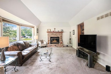 Great room w/ fireplace & tall tray ceilings