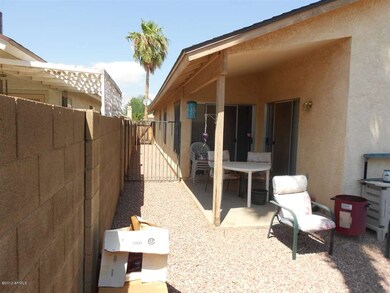 Side yard for pet and covered patio