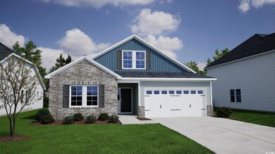 Craftsman house with a garage and a front lawn
