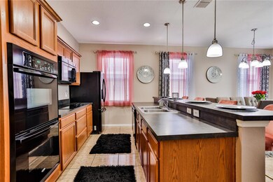 Kitchen with island breakfast bar