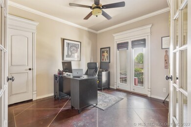 Office with closet and view to front yard, stained