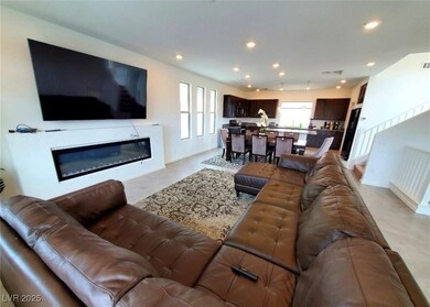 Living area featuring recessed lighting, a glass c