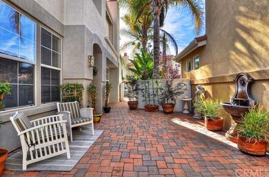 Wrought iron gates welcome you into a private & ro