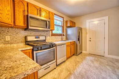 Kitchen.Oak cabinets ,Brand new stainless steel ap