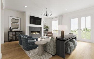 Living room with a fireplace, light wood-type floo