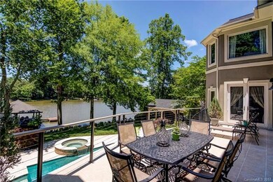 Tile patio overlooks your oasis with spiral stairc