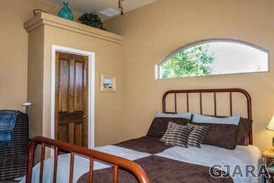 The guest bedroom is nicely finished with interest