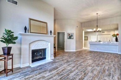 There is a natural gas fireplace with hearth and n