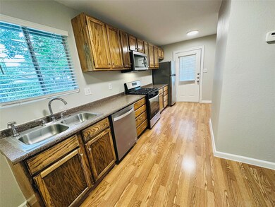 Kitchen featuring appliances with stainless steel