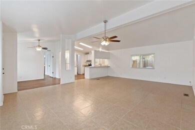 The living room, dining room and kitchen flow together seamlessly.