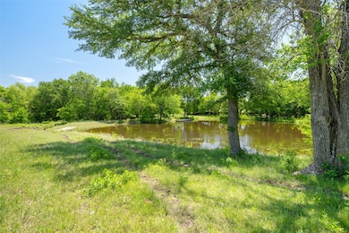 View of yard with a water view