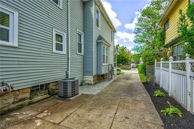 View of side of home featuring a patio area and central AC