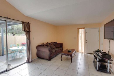 ALT VIEW OF FRONT RM FROM DINING W PATIO