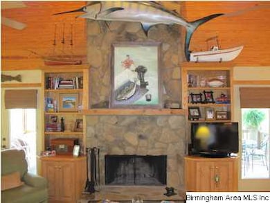 Large family room with rock fireplace