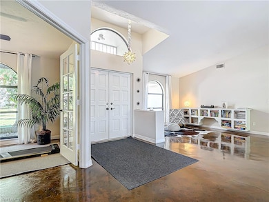 Foyer entrance featuring a chandelier
