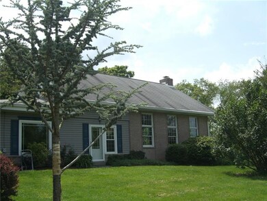 Side view showing the original home and the huge b