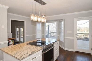 Kitchen has large bay window that provides natural