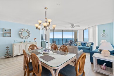 Dining area featuring ceiling fan with notable cha