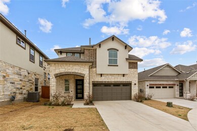 View of front of property featuring stone siding,