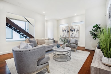 LIVING.   The floating staircase to the third floo
