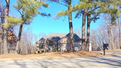 Beautiful pines line the front yard. This home has a brand new roof installed Nov. 2017.