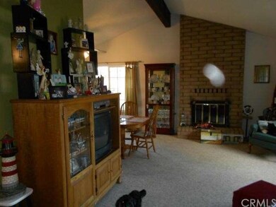 formal Living room w/ beam, & cathedral ceiling
