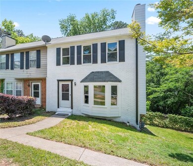 Townhome / multi-family property featuring a chimn