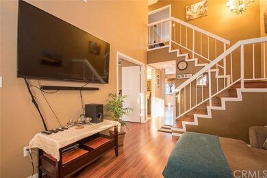 ANGLE VIEW OF THE LVIINGROOM LEAD TO STAIRCASE WIT