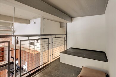 Accessed by a winding staircase, this cozy lofted