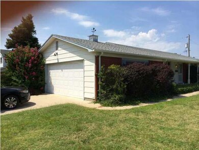 SOUTH SIDE OF HOME SHOWING SIDE LOAD 2 CAR GARAGE