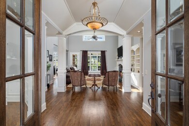 Upon entering the grand foyer you will find an extravagant floor plan accented by soaring ceilings, gleaming hardwood floors, elegant columns, a decorative chandelier and an abundance of windows