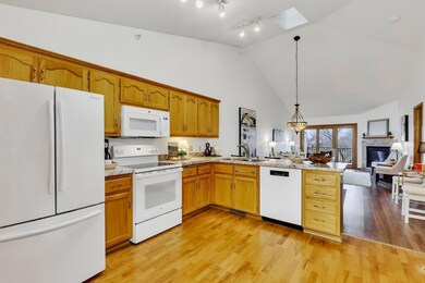 Real hardwood flooring in kitchen and entrance