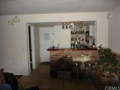 Wet bar in Family Room. Door leads to garage.