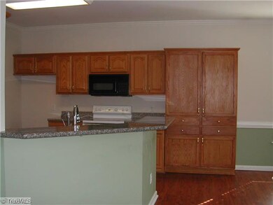 Kitchen. Open kitchen to living areas, plenty of room for stools at the breakfast bar.