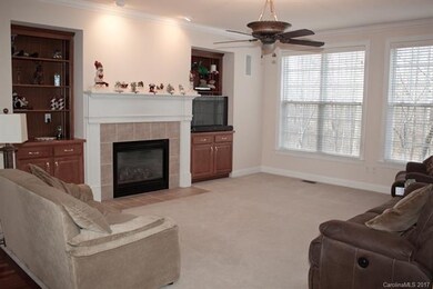 Living Room with built in's and gas fireplace.