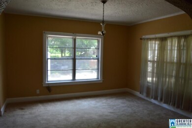 Dining room is bright and spacious and open to bot