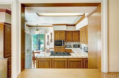 Kitchen with passthrough to living room.