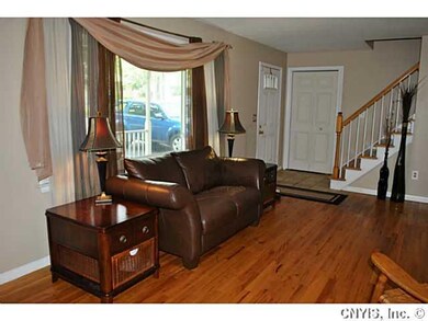 Living Room. An oversized picture window lets in p